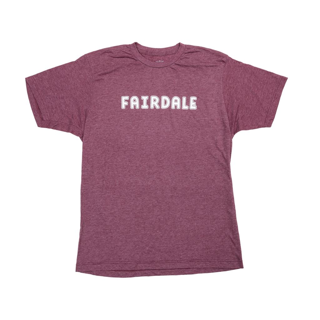 The Fairdale Outline T-Shirt is a heathered maroon, short-sleeve tee from the fall line, featuring "FAIRDALE" in bold white uppercase letters across the chest.