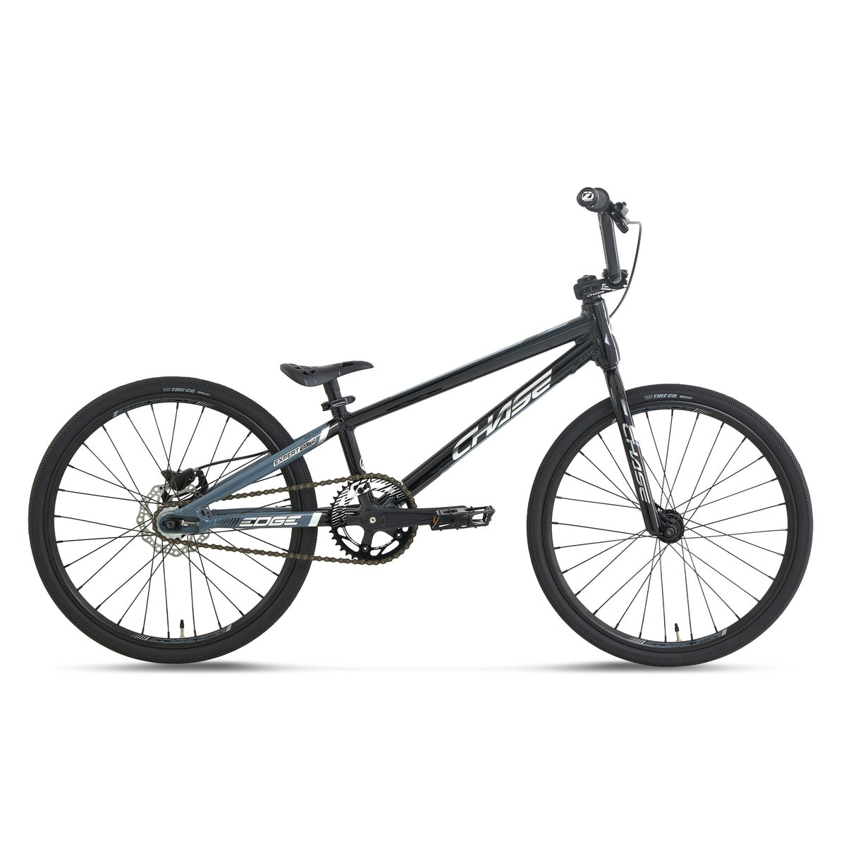 The Chase Edge Expert Race Bike (2027) is shown in profile on a white background, featuring a lightweight aluminum frame, integrated head tube, flat handlebars, single gear, and 20-inch wheels in a sleek black finish.