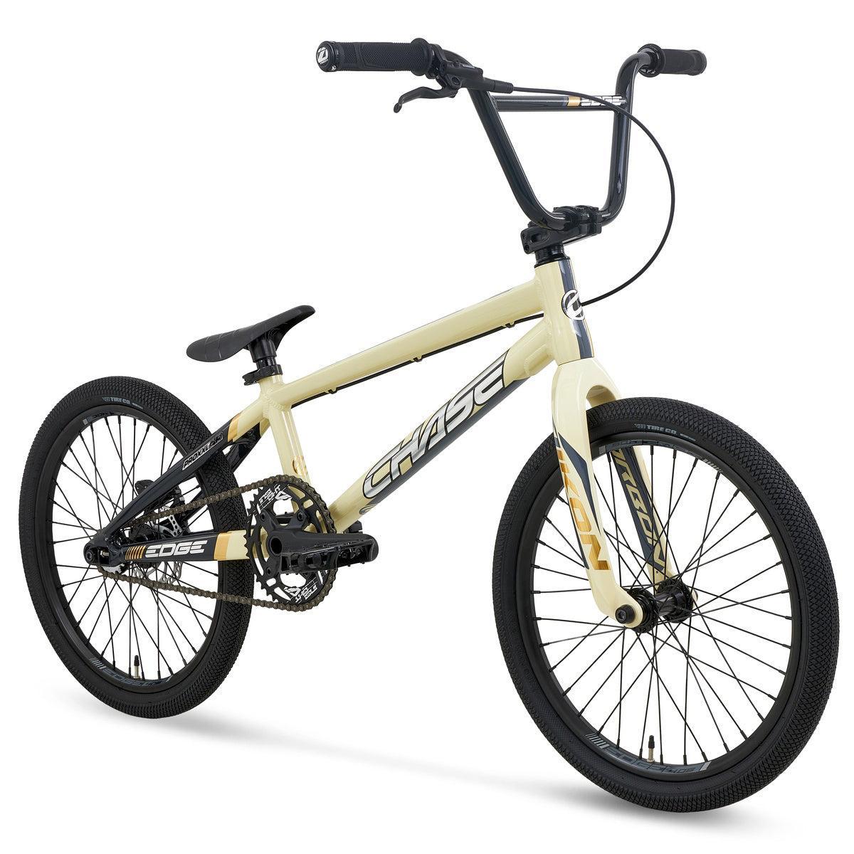 A Chase Edge Pro XXL CF Race Bike (2027) in beige, featuring black handlebars, a lightweight carbon fork, black wheels, and bold “CHASE” branding on the frame, displayed against a white background.