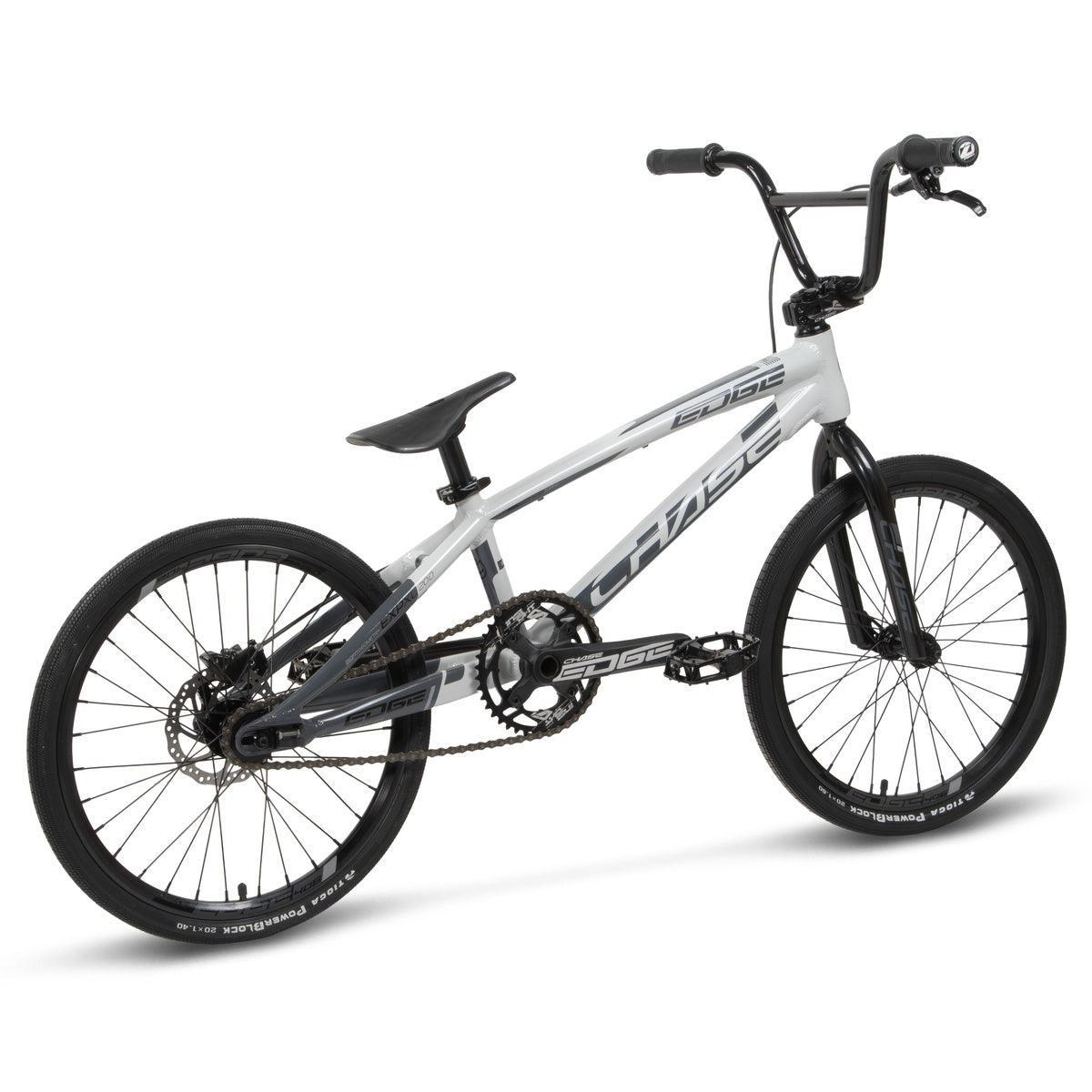 The Chase Edge Expert XL Bike (2026) is a white and black BMX race bike with thick tires, flat handlebars, a raised seat, and a hydroformed aluminium frame, shown on a plain white background.