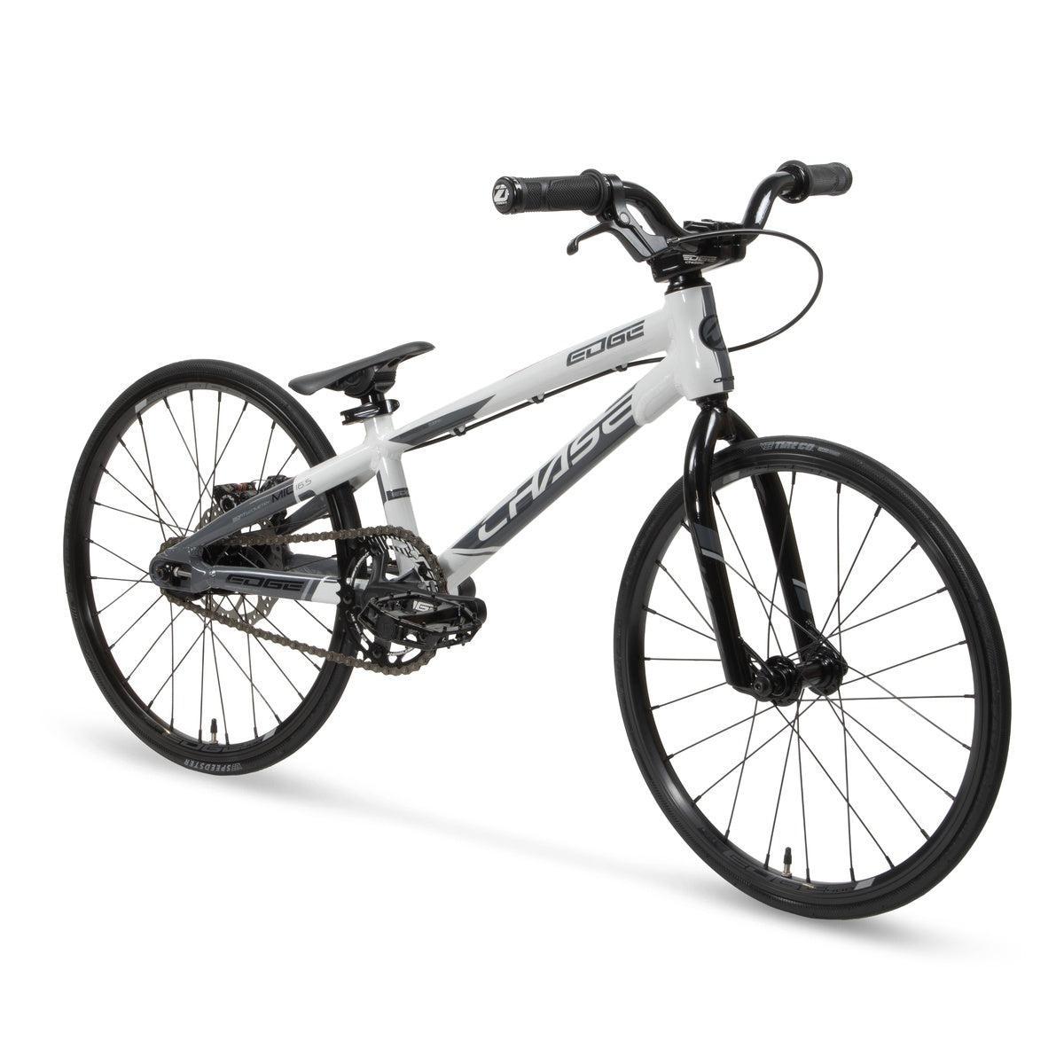 The Chase Edge Micro 18 Bike (2026), featuring a white and black 6061 aluminum frame, flat handlebars, and thin tires, is shown angled on a white background.