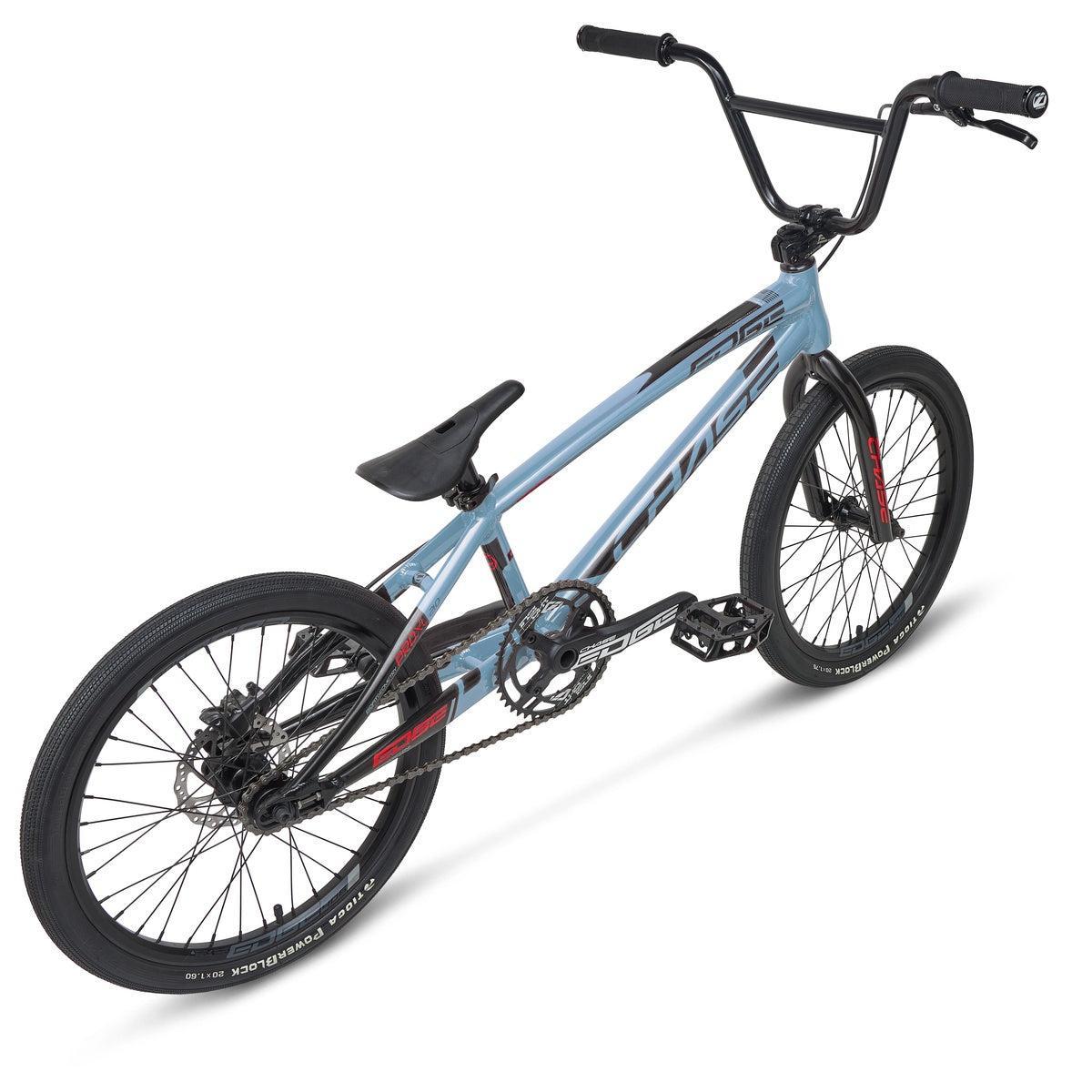 The Chase Edge Pro L Bike (2026) is a blue BMX with black handlebars, seat, and tires, displayed from a rear side angle against a white background.