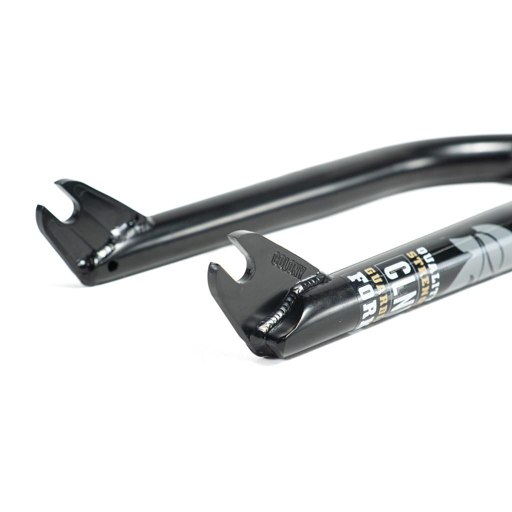 Close-up of dropouts on Colony Guardian 20 Inch Forks, showing welded joints, CNC machined detailing, and part of a label with text.