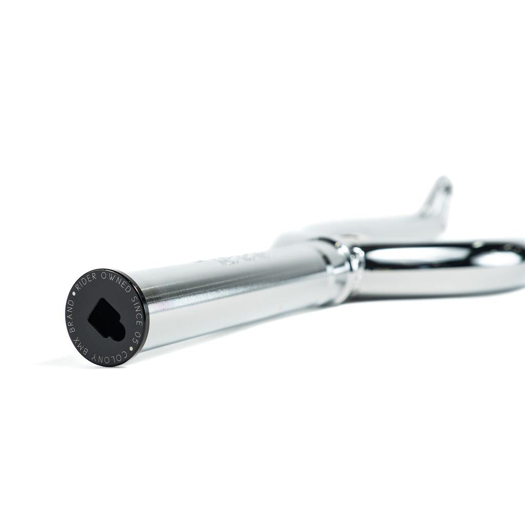 Close-up of a metallic scissor with focus on the engraved text near the handle end, crafted with precision like the Colony Guardian 20 Inch Forks, photographed on a white background.
