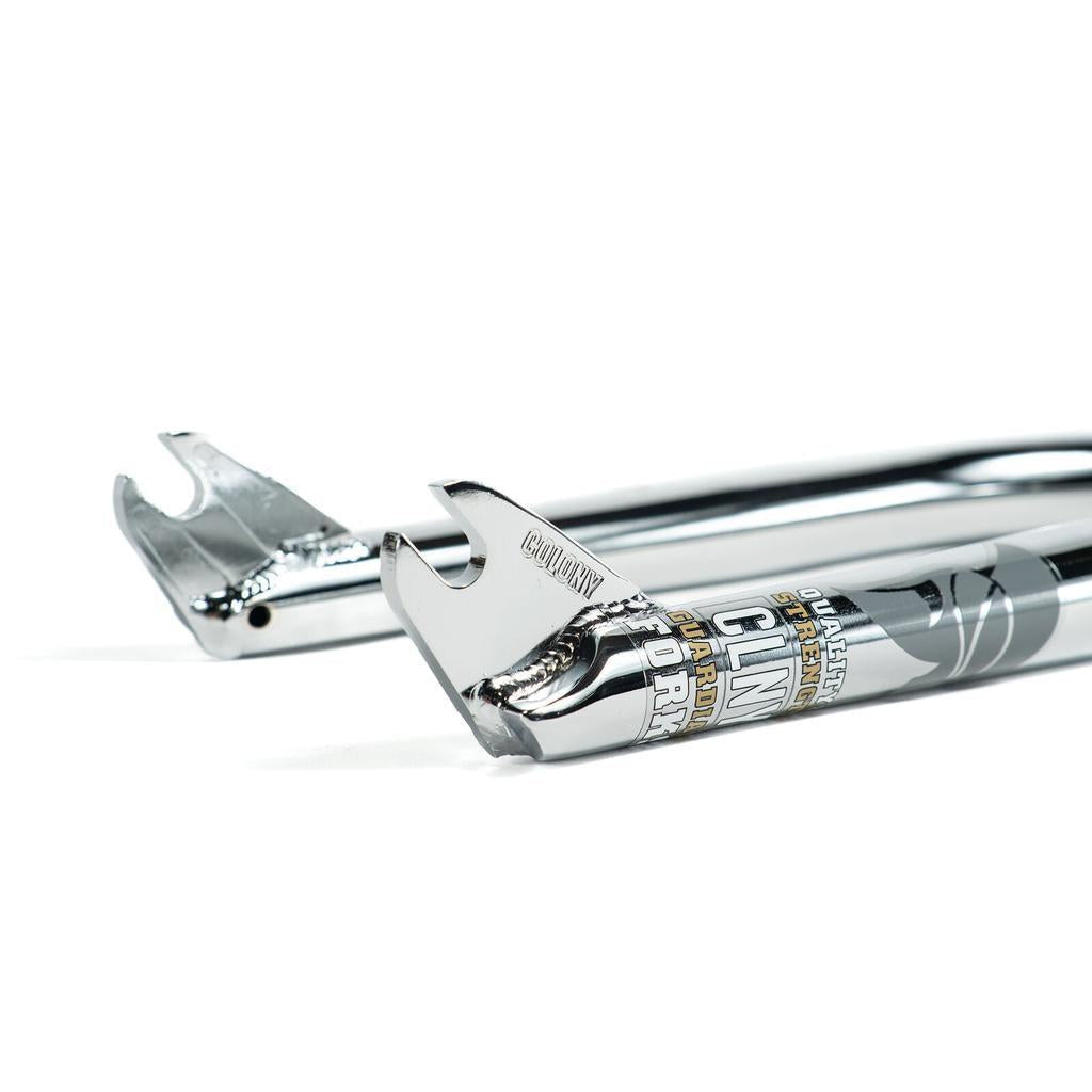 Close-up of two Colony Guardian 20 Inch Forks, made from chrome 4130 CrMo with CNC machined steer tubes, visible welds, and branded decals, displayed on a white background.