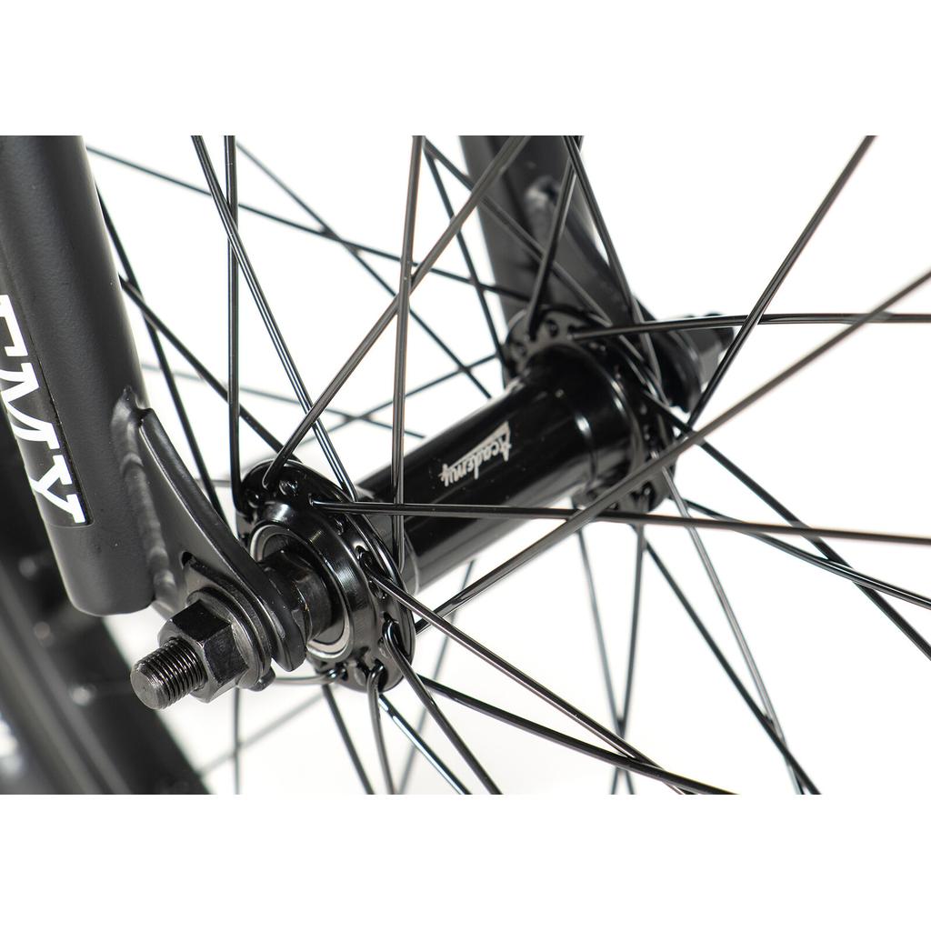 Close-up of a black wheel hub with spokes and axle attached to the front fork of the Academy Trooper 20 Inch Bike, a youth BMX model.