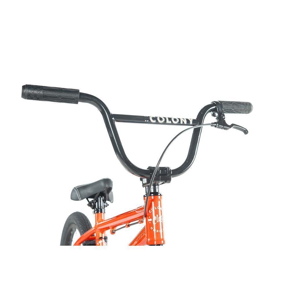 Close-up of the Colony Horizon 16 Inch Bike’s handlebars, brake lever, and red frame with “COLONY” branding—ideal for any freestyle BMX rider.