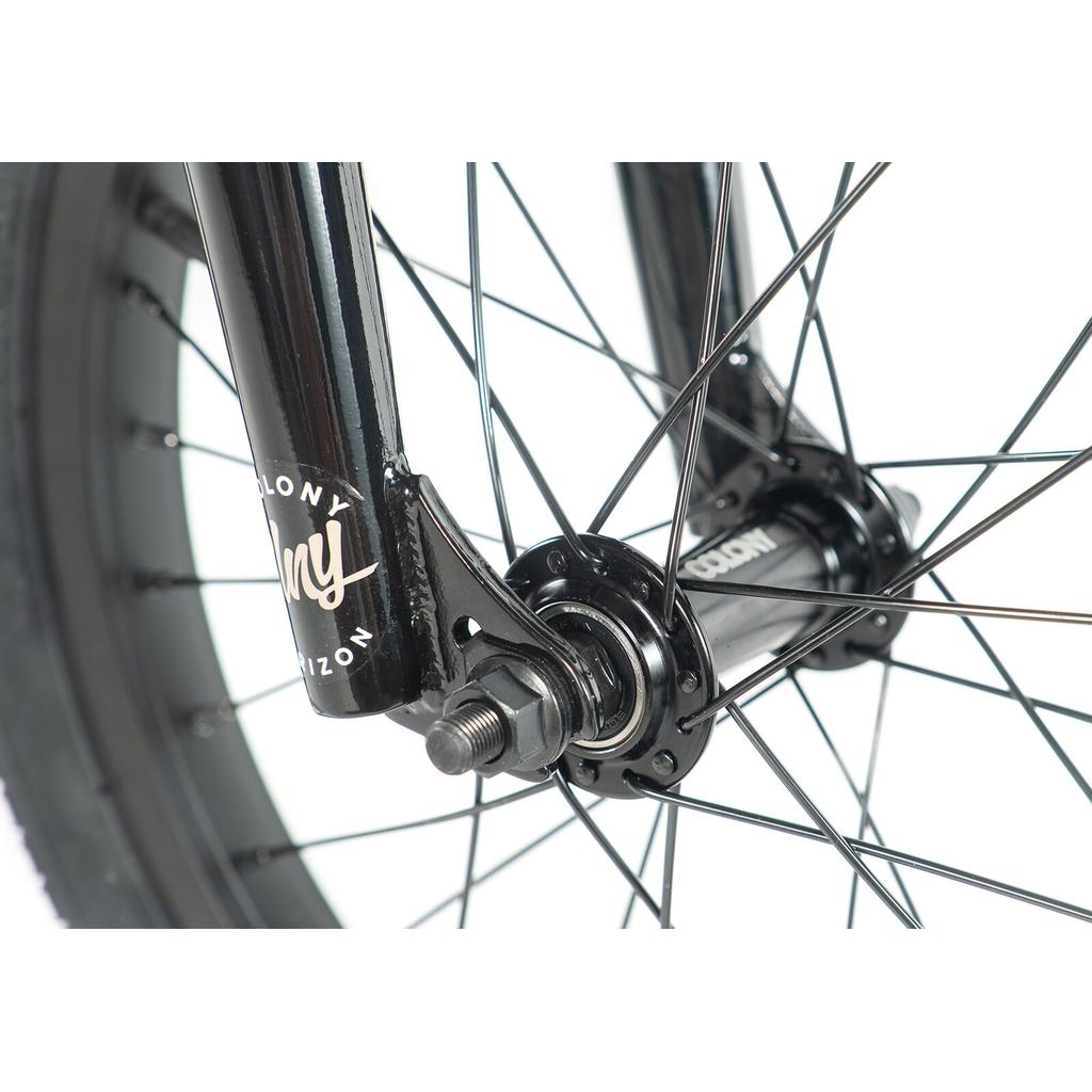 Close-up of the Colony Horizon 16 Inch Bike’s black front wheel hub and fork with spokes, highlighting detailed metal parts and tire—perfect for freestyle riders seeking precision.