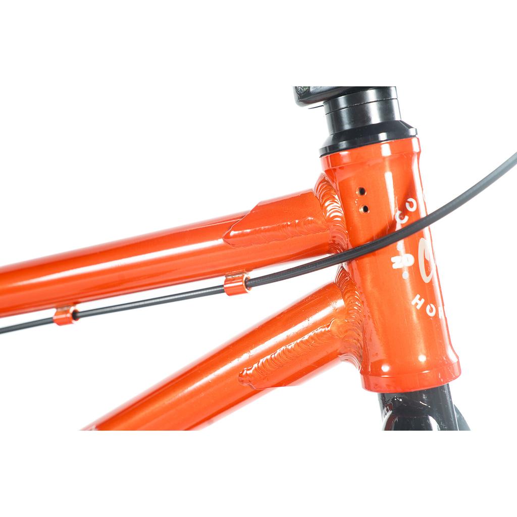 Close-up of a Colony Horizon 18 Inch Bike frame showing the head tube, top tube, down tube, cable routing, visible welds, and part of the headset—a BMX-inspired design for young freestyle riders.