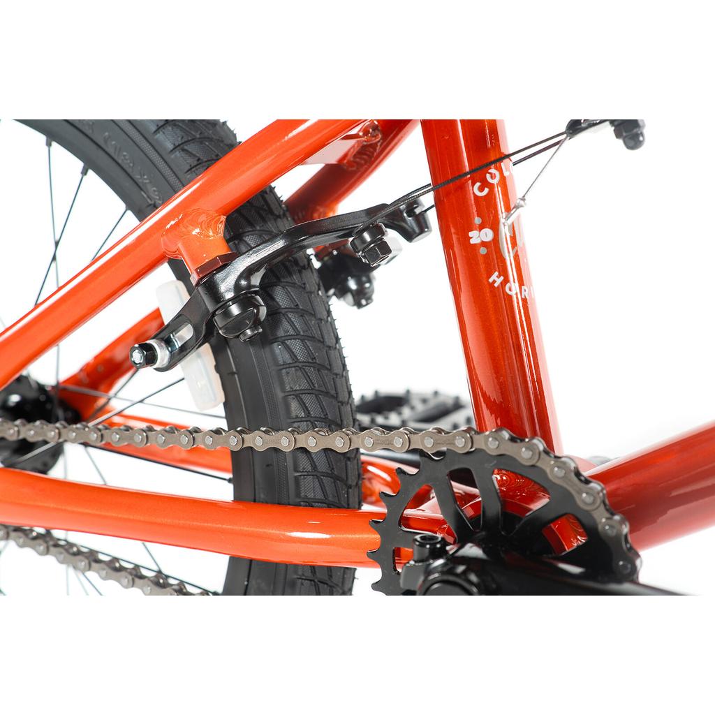 Close-up view of the Colony Horizon 18 Inch Bike’s rear wheel, chain, gear, and brake mechanism against a white background, featuring a lightweight alloy frame.