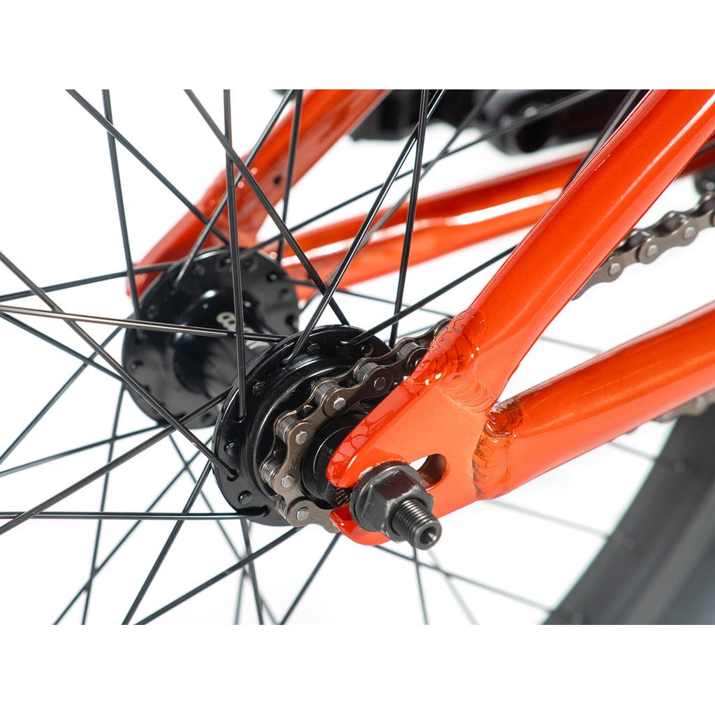 Close-up of the rear wheel and gear mechanism on a Colony Horizon 20 Inch Bike, highlighting the chain, spokes, and axle bolt—an ideal setup for freestyle BMX riding.