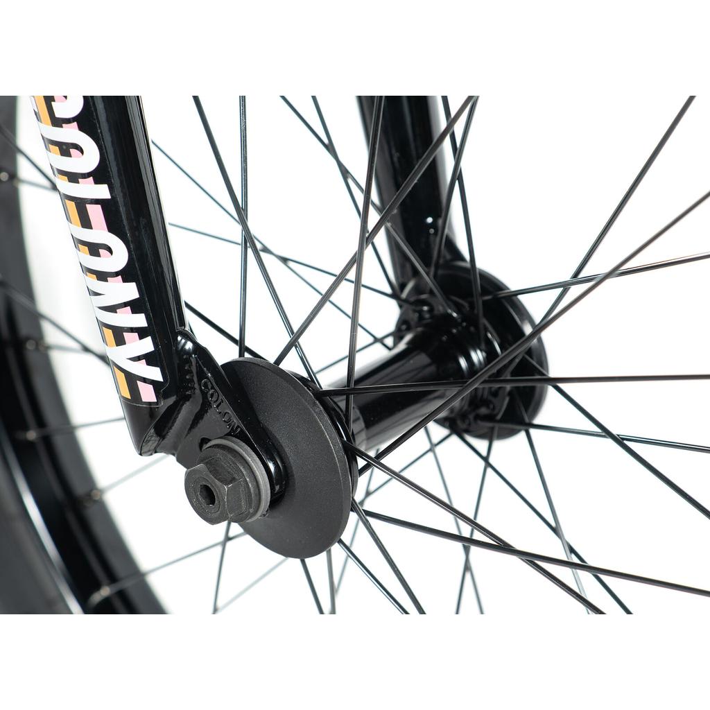 Close-up of the Colony Premise 20 Inch Bike’s front wheel showing double-wall rims, fork, hub, axle nut, and spokes against a white background.