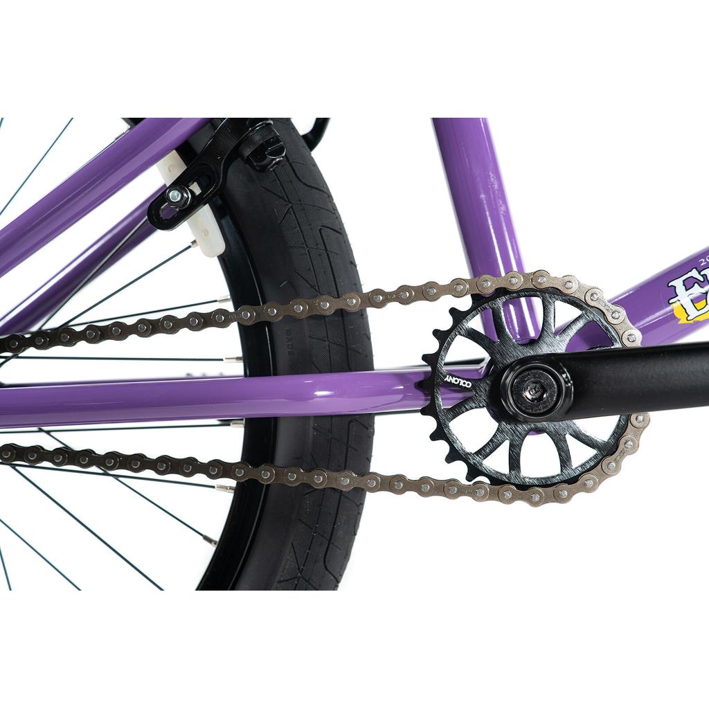 Close-up of the Colony Endeavour Bike's rear wheel, black tire, chain, and black chainring against a white background.