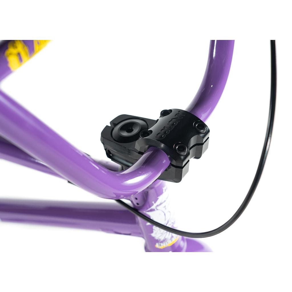 Close-up of the Colony Endeavour Bike's purple BMX handlebar with a black stem clamp and brake cable, set against a white background.