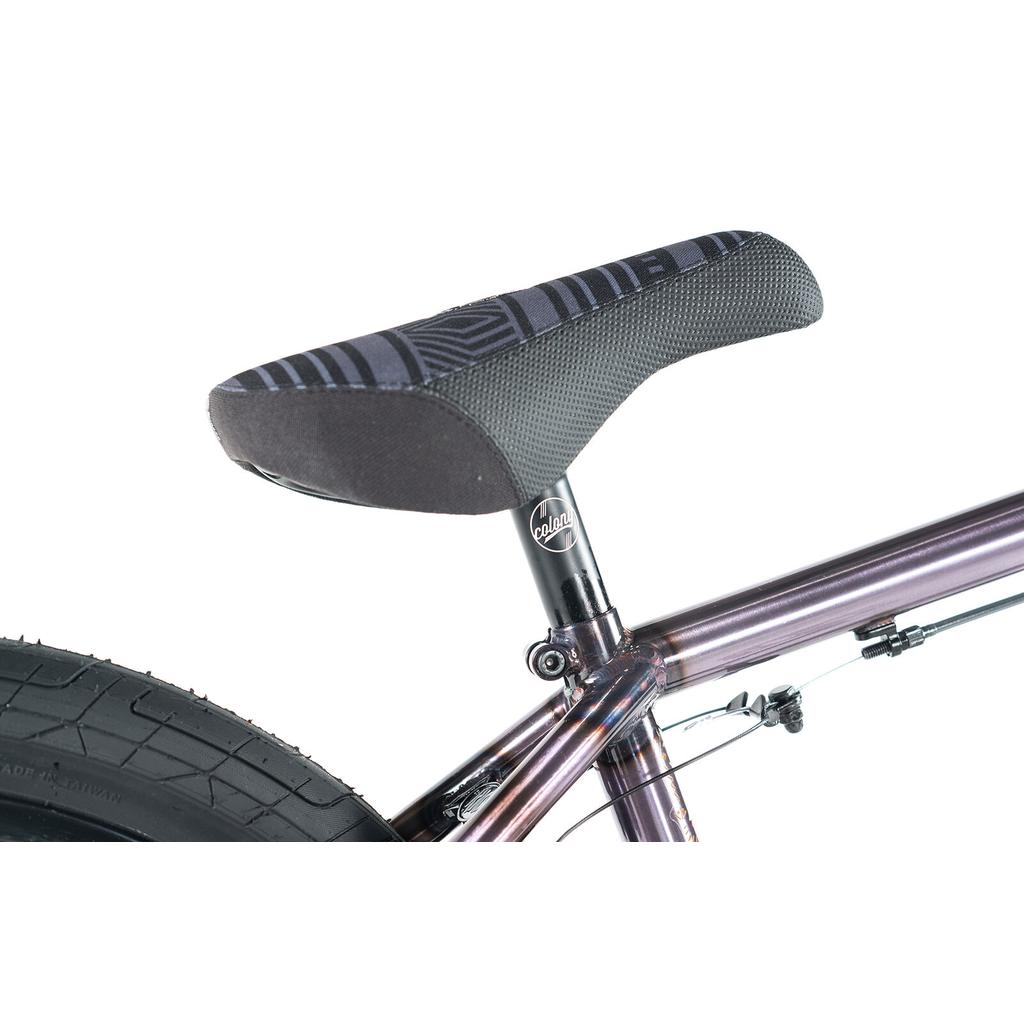 Close-up view of the Colony Rico Elite 20 Inch Bike’s saddle and seat post mounted on its CrMo frame, with part of the rear tire visible.