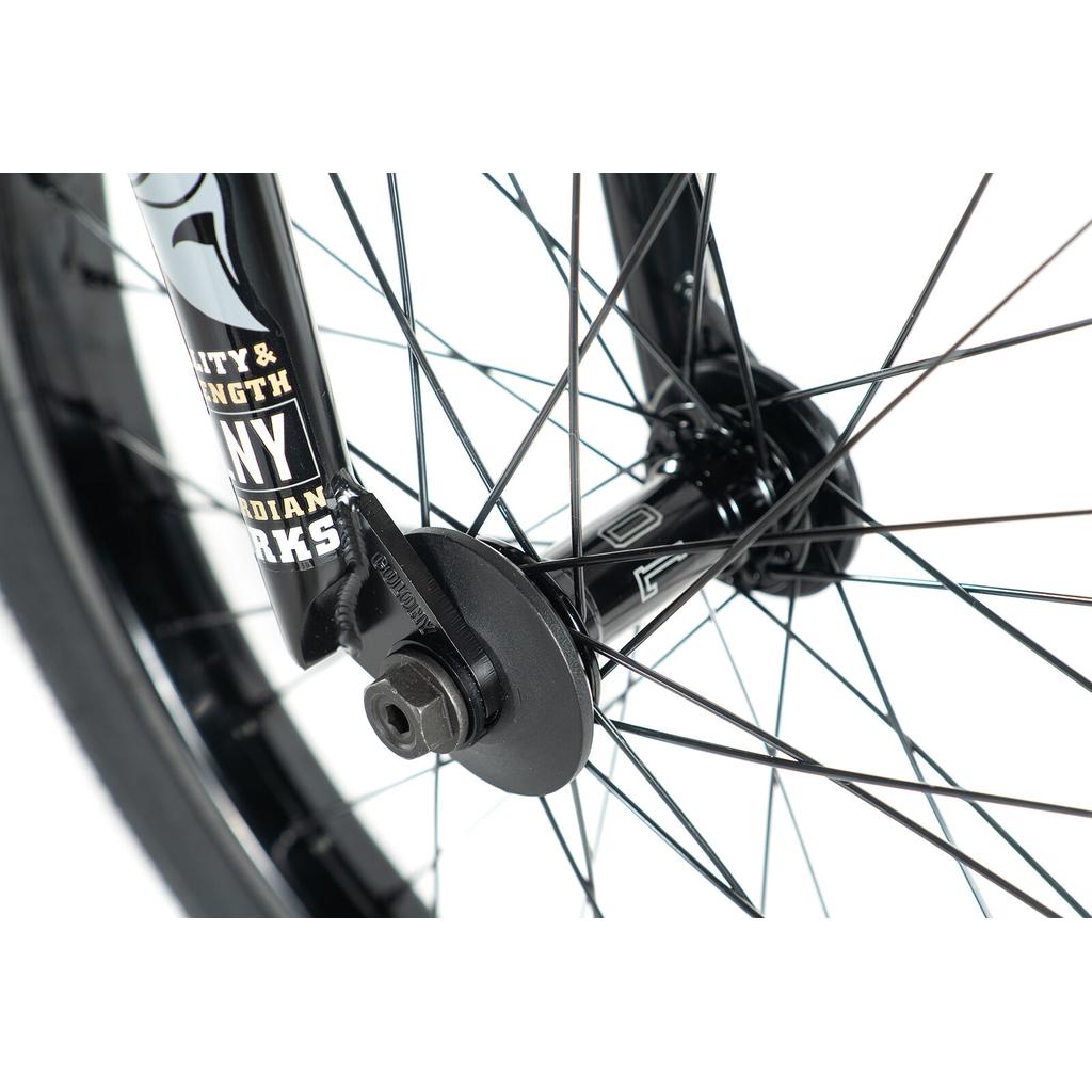 Close-up of a black BMX bike front wheel hub with spokes, axle nut, and labeled fork—showcasing the Colony Rico Elite 20 Inch Bike for pro-level performance.