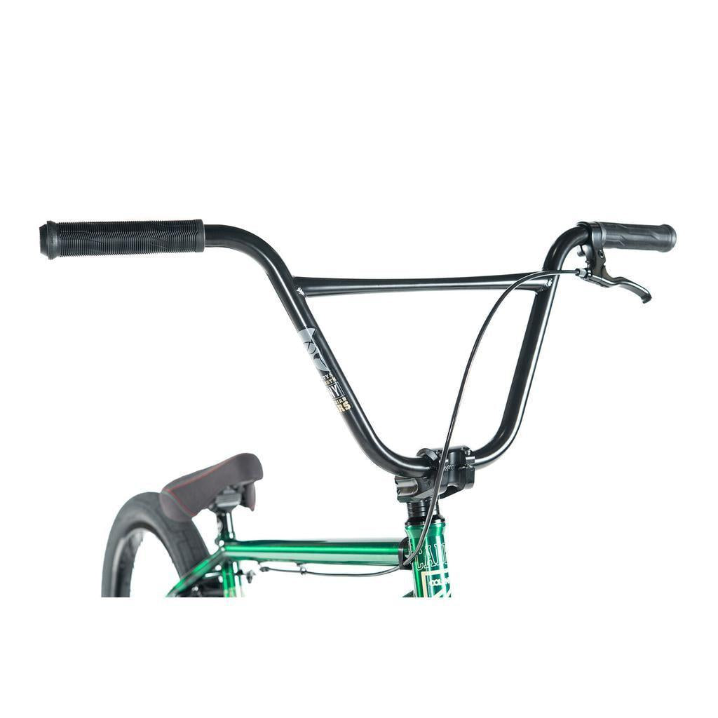 Close-up of the Colony Cadet Elite 20 Inch Bike, featuring black handlebars, a brake lever, and the top of its green frame against a white background.