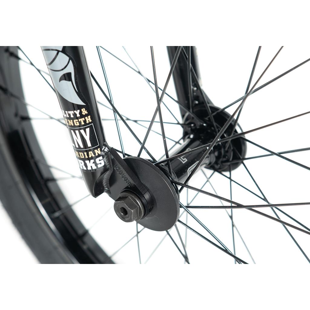 Close-up of the black front wheel hub, spokes, axle nut, and fork branding on the Colony Cadet Elite 20 Inch Bike—designed for pro-level BMX performance.