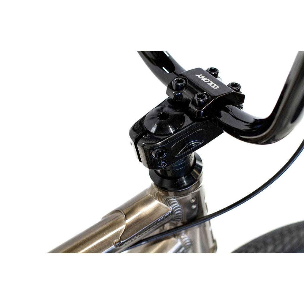 Close-up of the Colony Horizon 18 Inch Bike’s handlebar stem with a black clamp, attached to a lightweight alloy frame featuring visible welds and a cable.