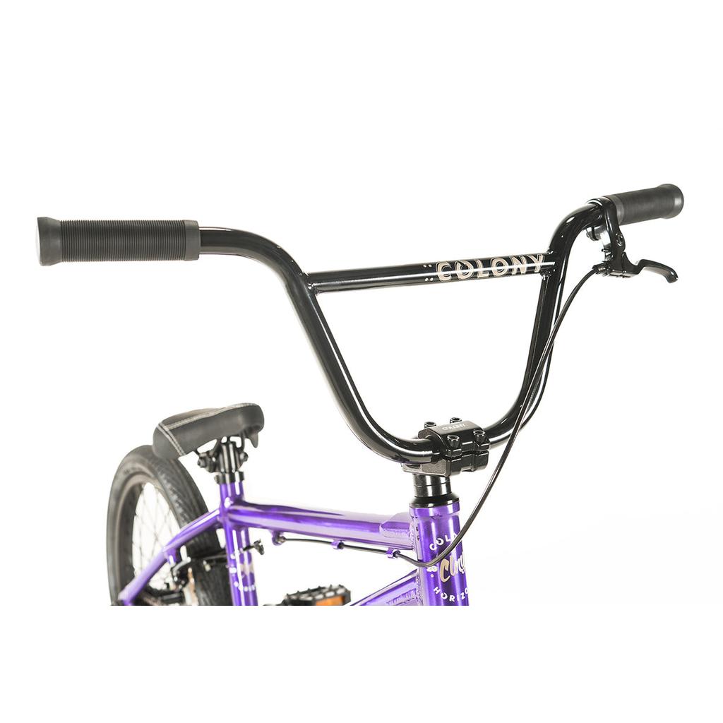 A close-up of the Colony Horizon 18 Inch Bike shows its lightweight alloy frame, black handlebars with a brake lever, and the "Colony" logo on the handlebars.