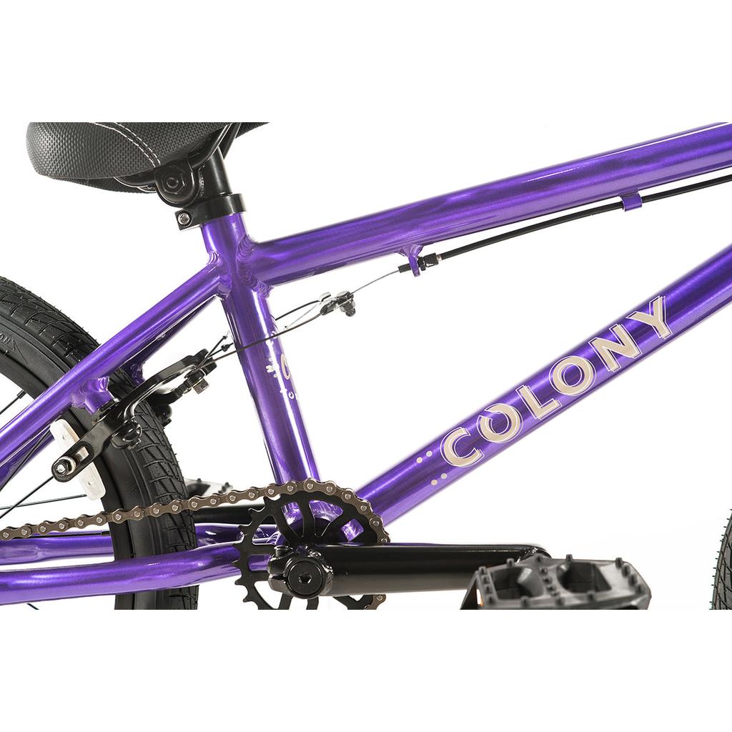 Close-up view of the Colony Horizon 18 Inch Bike in purple with a lightweight alloy frame, seat, rear wheel, chain, and brake cables visible against a white background—ideal for freestyle Olympic riders.
