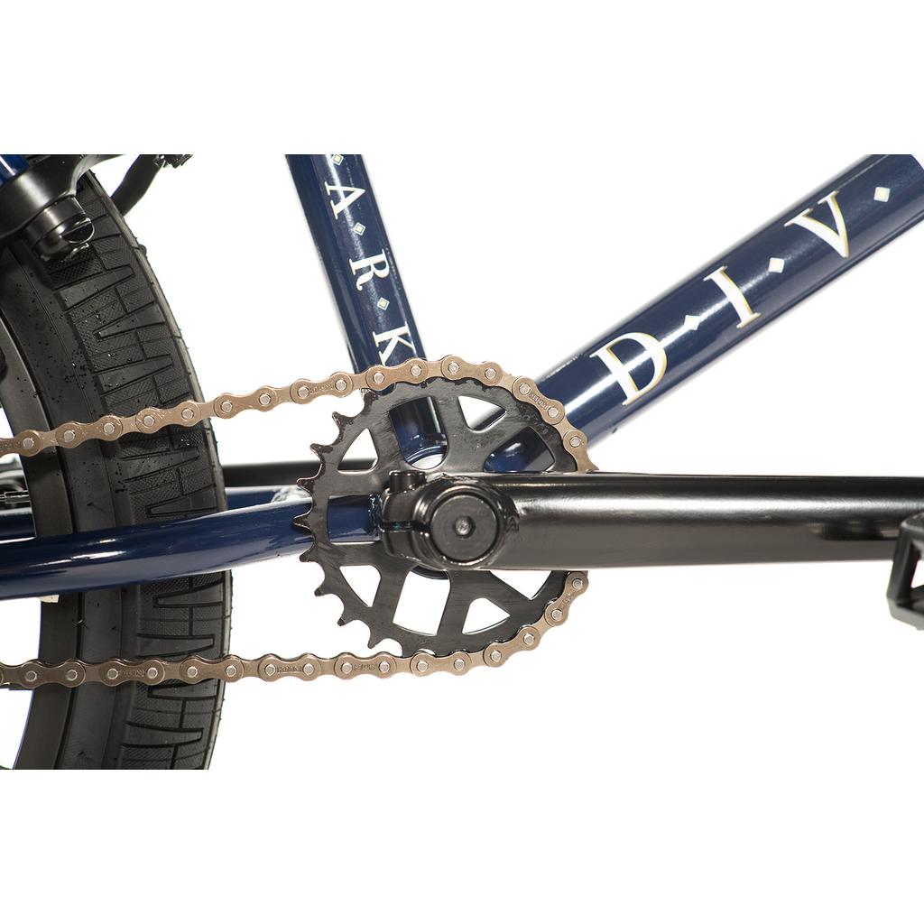 Close-up view of the Division Reark 20 Inch Bike’s rear wheel, chain, and 3-piece cranks with a sealed bottom bracket against a white background.