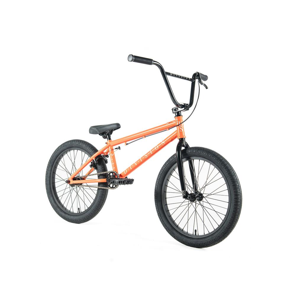The Division Reark 20 Inch Bike in orange features black handlebars, seat, pedals, and wheels with durable 3-piece cranks. Displayed on a white background.