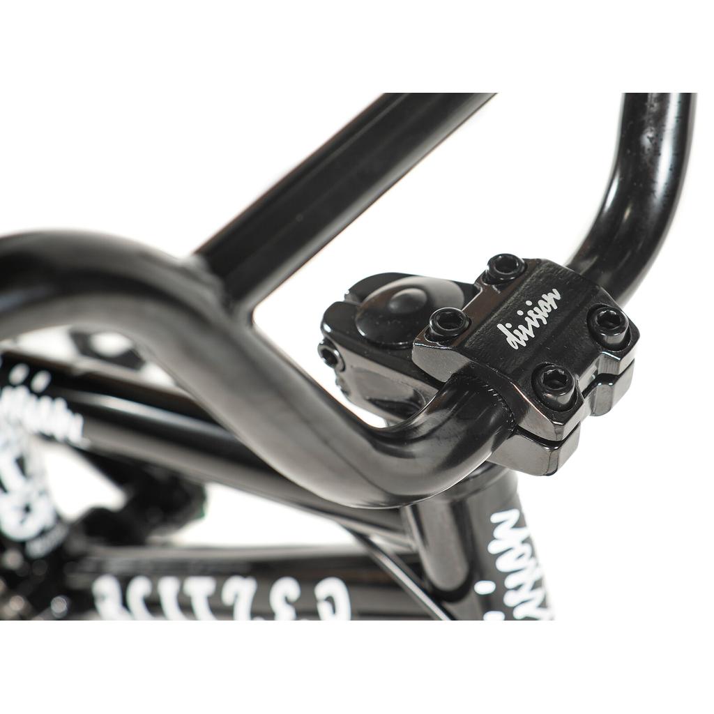 Close-up of the Division Blitzer 12 Inch Bike's black freestyle BMX handlebar stem with four mounting bolts and visible branding, ideal for kids BMX or a 12” BMX bike.