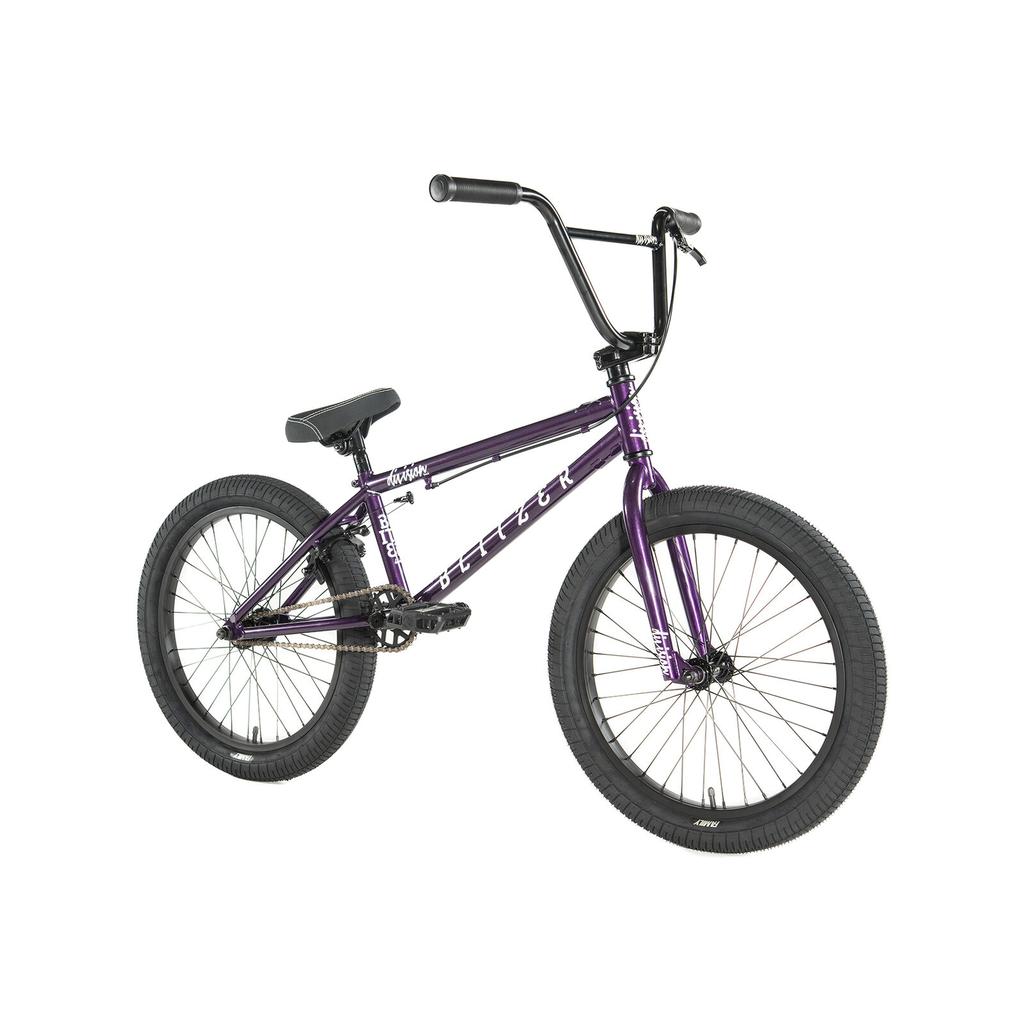 The Division Blitzer 20 Inch Bike is a purple beginner BMX with 20” wheels, black handlebars, seat, pedals, and tires, displayed against a white background.