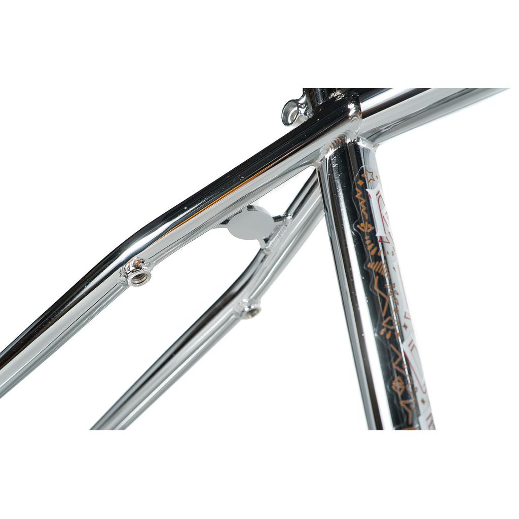 Close-up of the Colony Rico 'Lite' Frame’s polished chrome CrMo construction, showing seat tube, top tube, and seat stay junction—ideal for tech park & ramp riding, with visible decals and precise welds.
