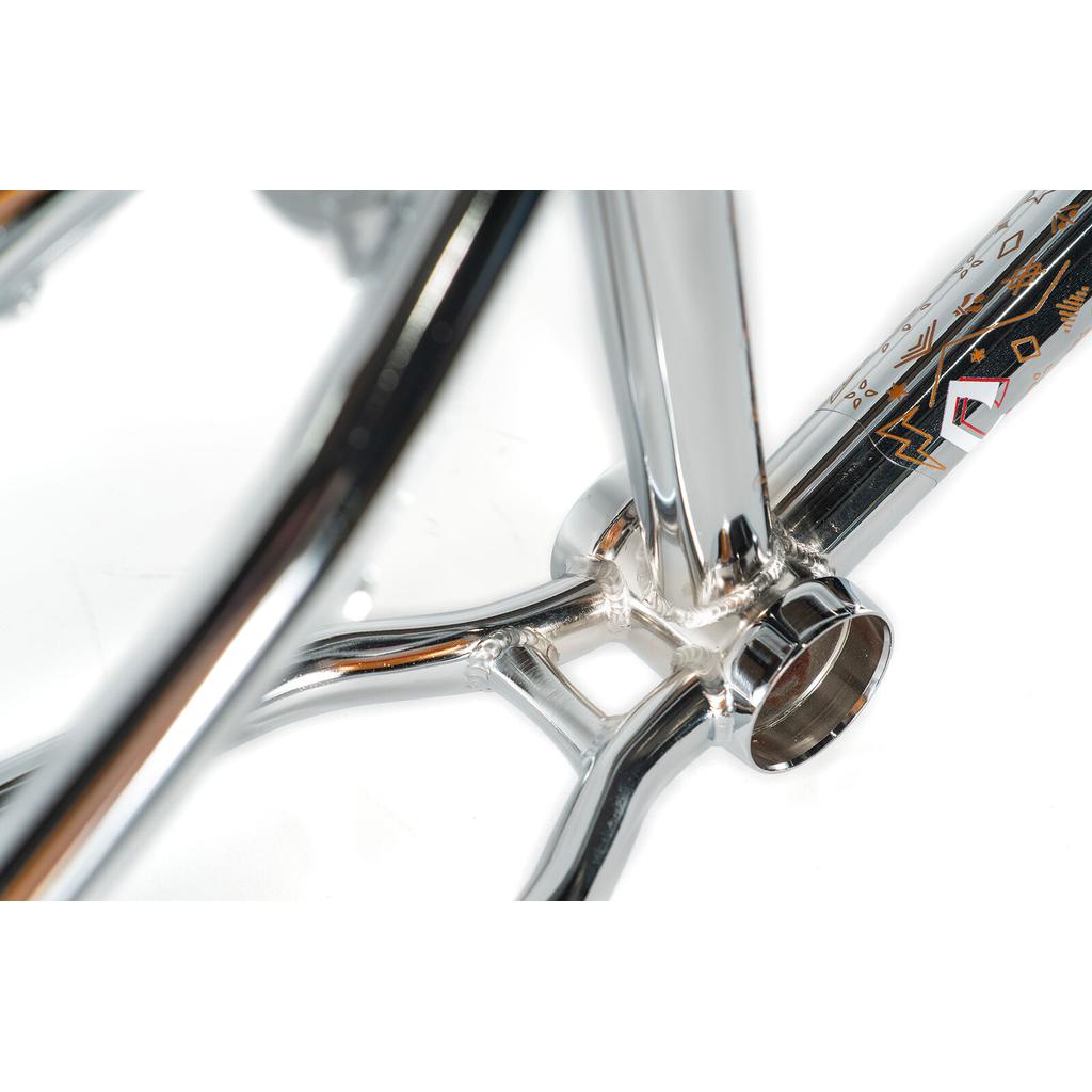 Close-up of the Colony Rico 'Lite' Frame's chrome bottom bracket area, highlighting smooth welds and geometric details—perfect for tech park and ramp riding with its full CrMo construction.