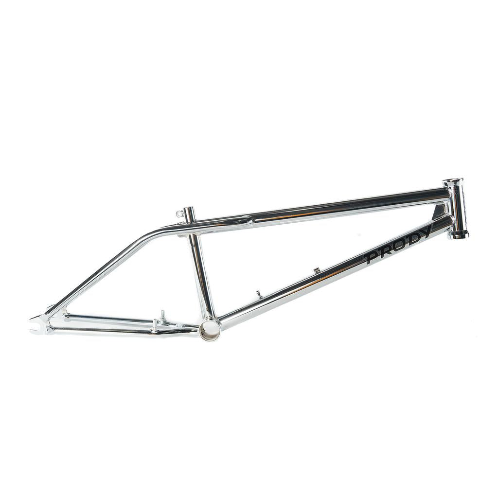 The Colony Prody Frame features a chrome finish, horizontal top tube, angled down tube, and "PRODY" branding—drawing inspiration from the classic Colony Clint Millar freestyle BMX frame design.