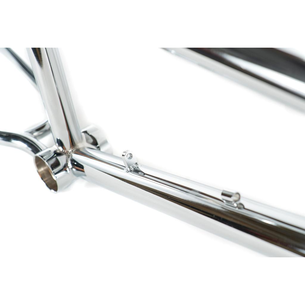 Close-up view of the polished Colony Prody Frame BMX freestyle frame, highlighting the bottom bracket area and the cable guide mounted on top of the chainstay.