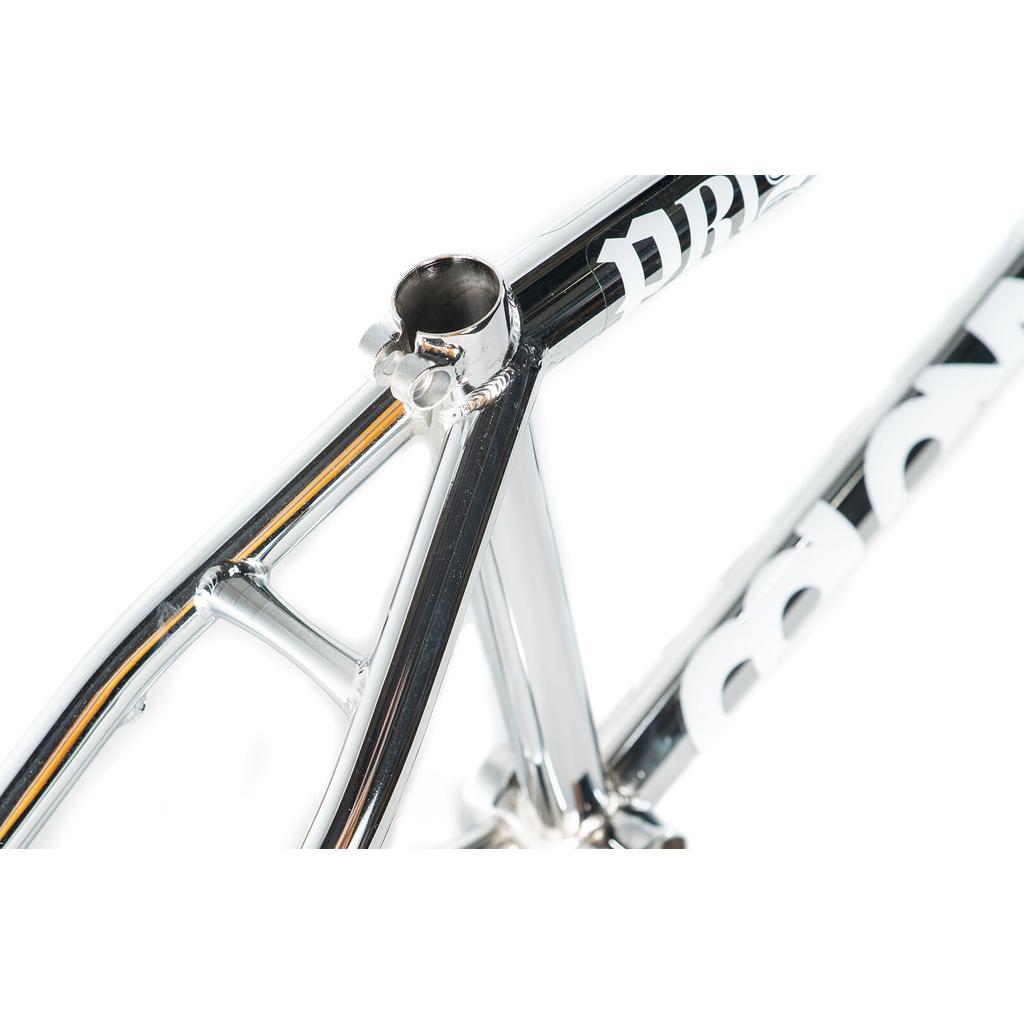 Close-up view of the Colony Prisma Frame in chrome, featuring CrMo construction with a focus on the seat tube, seat stays, and part of the top tube accented by bold white lettering.