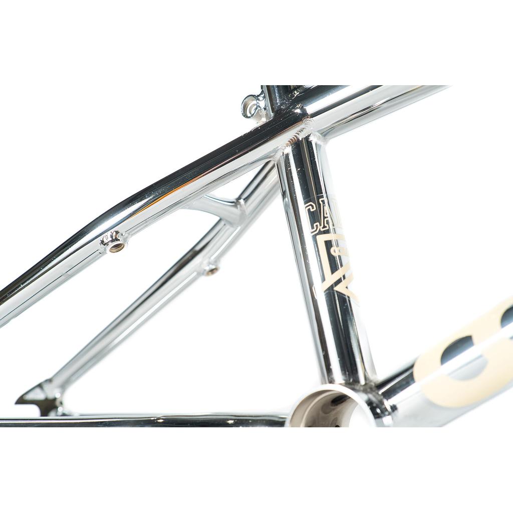 Close-up of the Colony Cadet 16 Inch Frame in polished chrome, showing the seat tube, top tube, and chainstay junction with quality CrMo construction against a white background.