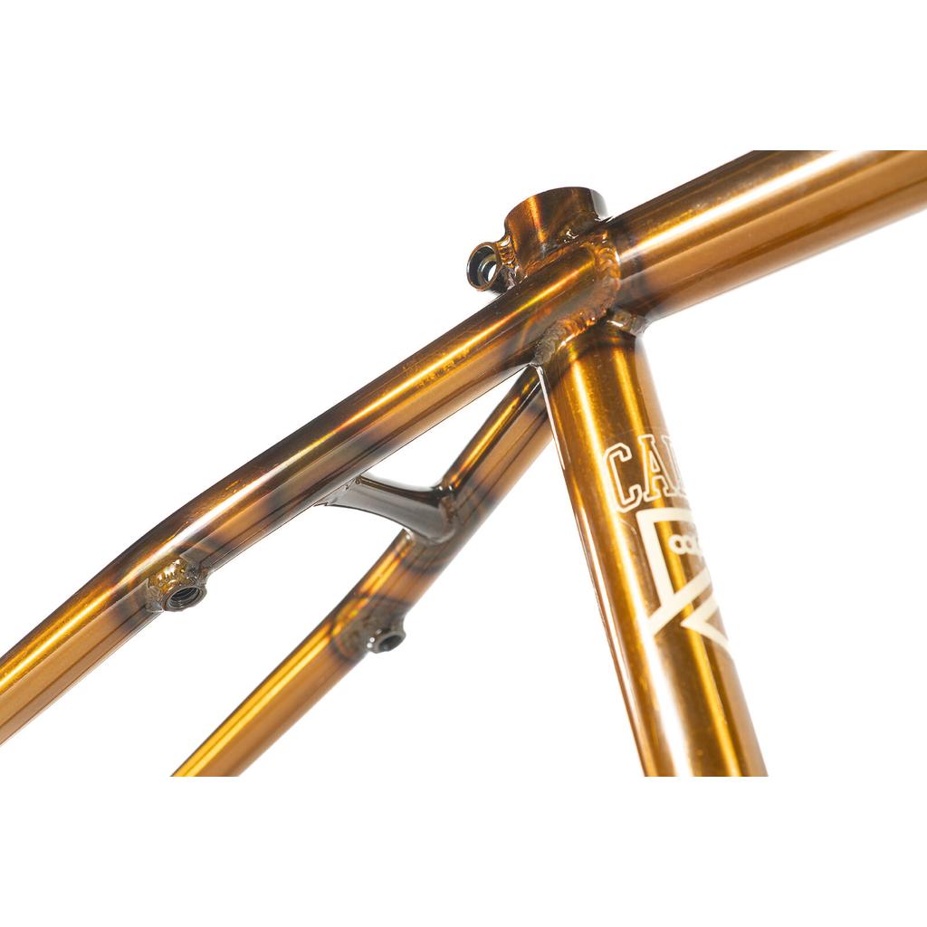 Close-up of a bronze-colored Colony Cadet 18 Inch Frame showing the seat tube and top tube junction.