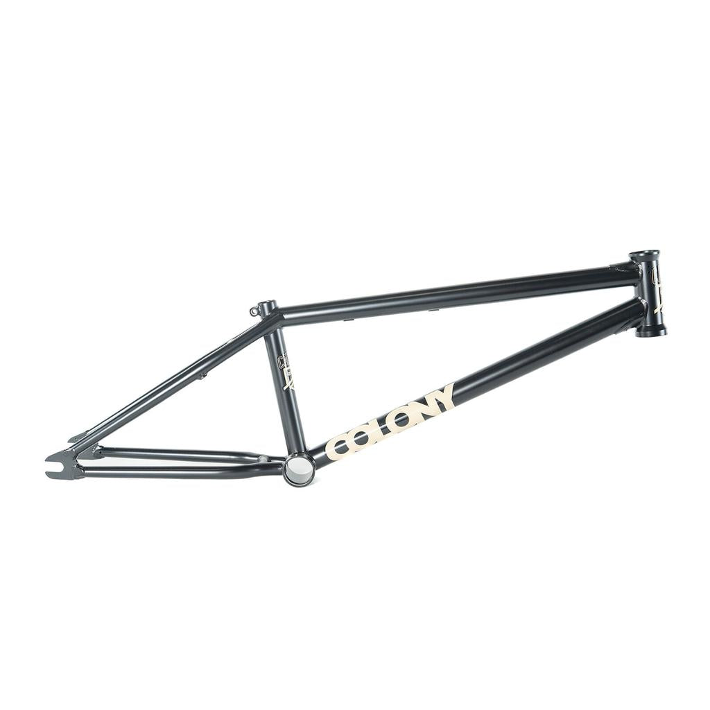 The Colony Cadet 20 inch Frame features a matte black finish with white “COLONY” branding on the lower tube, made from durable chromoly, and is shown against a plain white background.