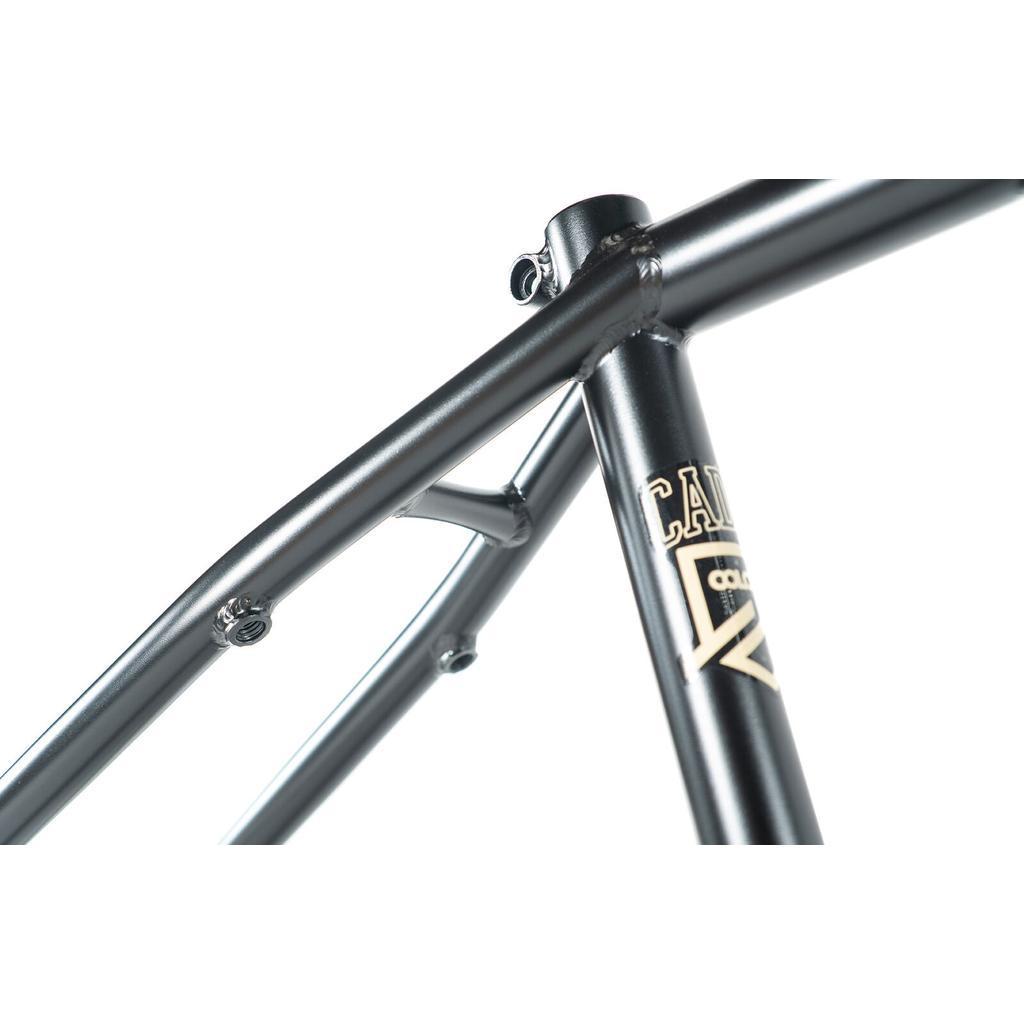Close-up of the Colony Cadet 20 inch Frame shows its metallic chromoly tubing, focusing on the seat tube, seat stays, and a “CA” decal detail, all set against a white background.