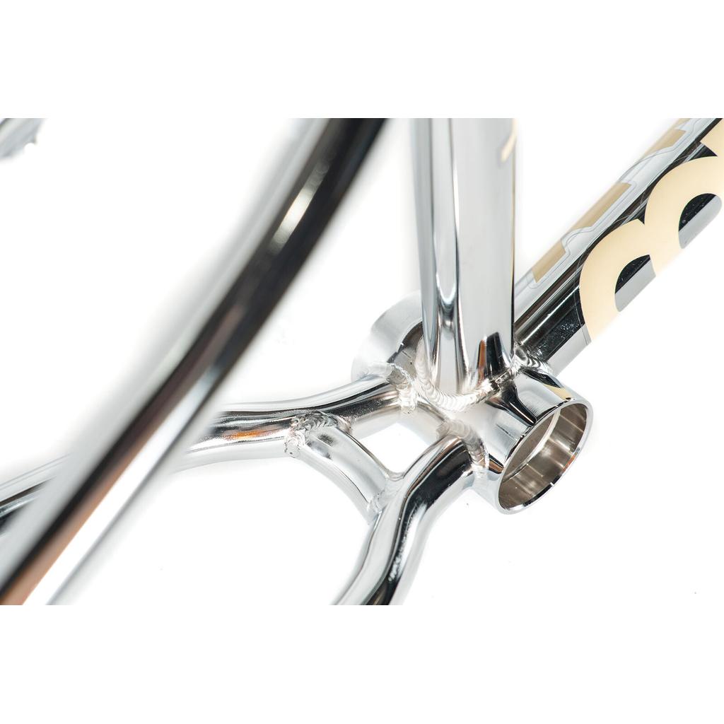 Close-up view of the Colony Cadet 20 inch Frame, highlighting the polished chromoly construction, bottom bracket area, and detailed weld joints.