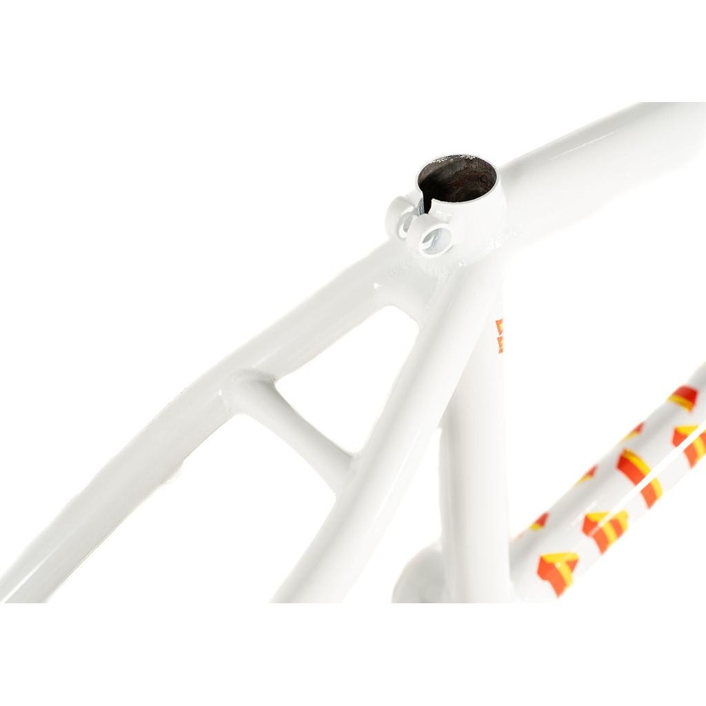 Close-up of the seat tube and rear triangle of the Colony Balkan Eagle Frame (Renato Rancso Signature) in white, featuring red and yellow geometric decals, shown without a seat post.