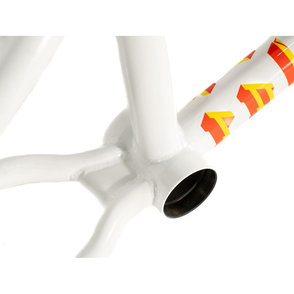 Close-up of the bottom bracket area of the white Colony Balkan Eagle Frame (Renato Rancso Signature), showcasing red and yellow graphic lettering on the down tube—emphasizing the Renato Rancso Balkan Eagle design—set against a white background.