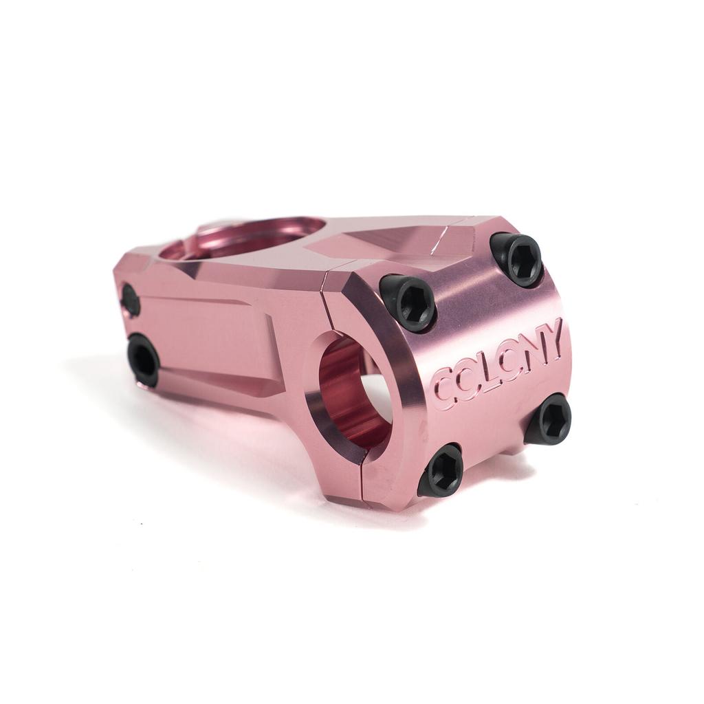 The Colony Official Front Load Stem is a pink BMX stem made from tough 7075T6 alloy, featuring black bolts and "COLONY" engraved on the front.