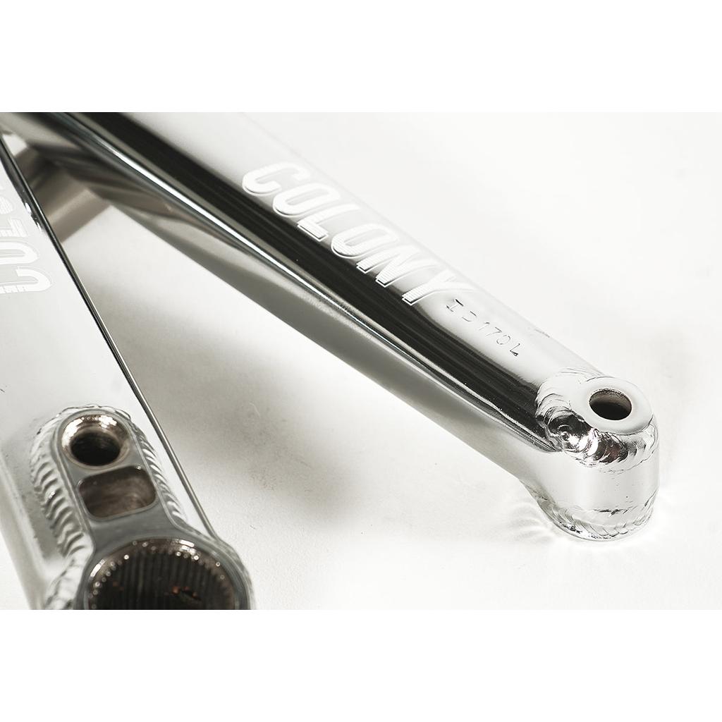 Close-up of two shiny, silver Colony Venator 140mm Cranks (Suit 18" Wheeled Bikes) with visible "COLONY 22T19L" branding, placed on a white background.