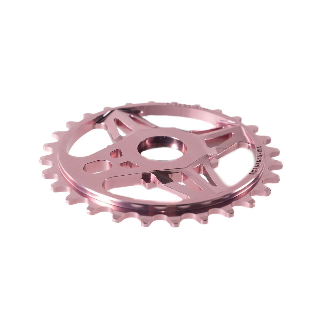 The Colony CC Sprocket, a metallic pink BMX sprocket CNC machined from 7075T6 alloy with a central hole and gear teeth, is displayed on a white background.