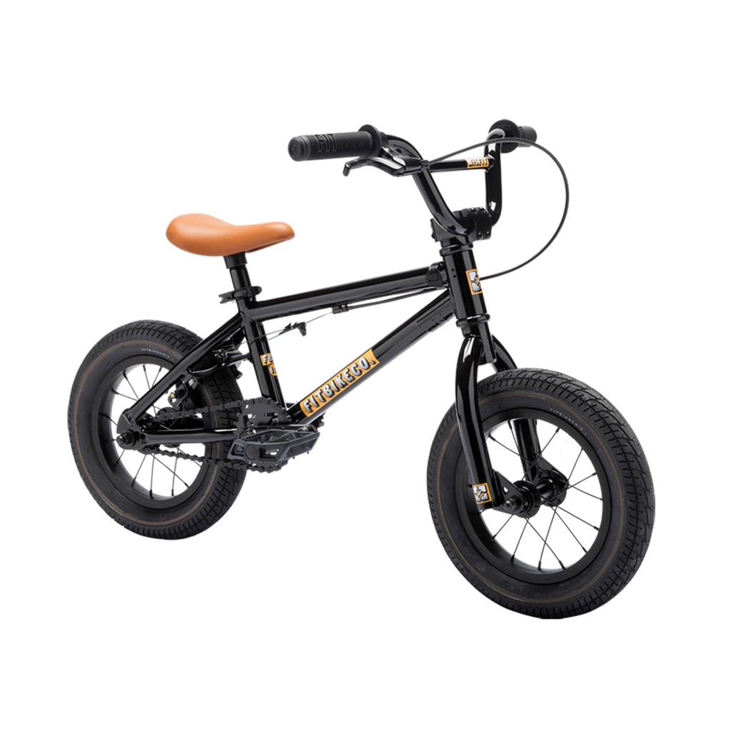 The Fit Misfit 12 Inch Bike is a small black bike with a tan seat, black handlebars, and thick tires—great as a first pedal bike for kids, shown on a white background.