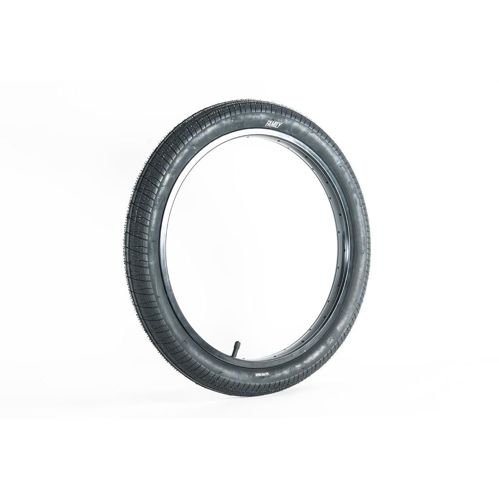 A Family BMX F603 20 Inch Tyre in black stands upright on a white background.