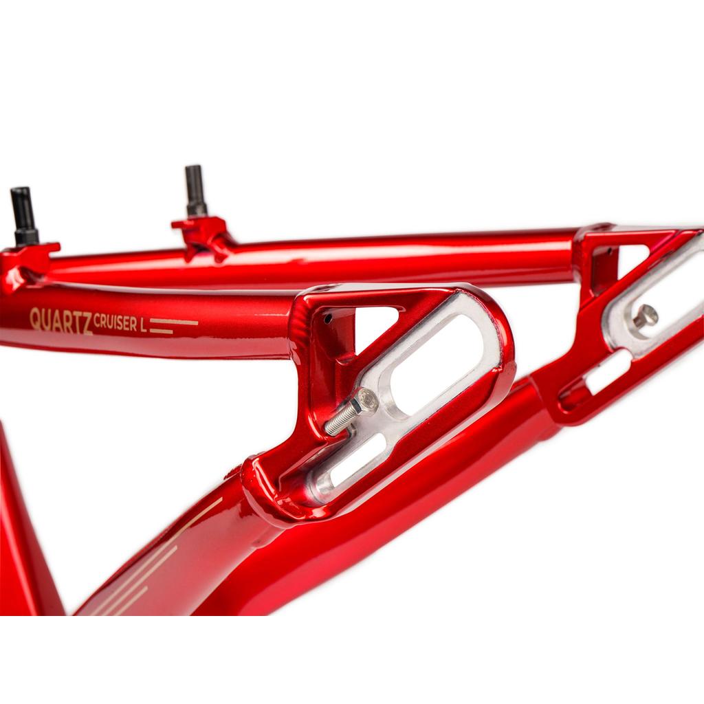 Close-up of the Radio Raceline Quartz 2025 Pro XL Cruiser Frame in red quartz, showing its rear sliding dropout disc system and seat stay, with a metallic finish inspired by top aluminium race frames.