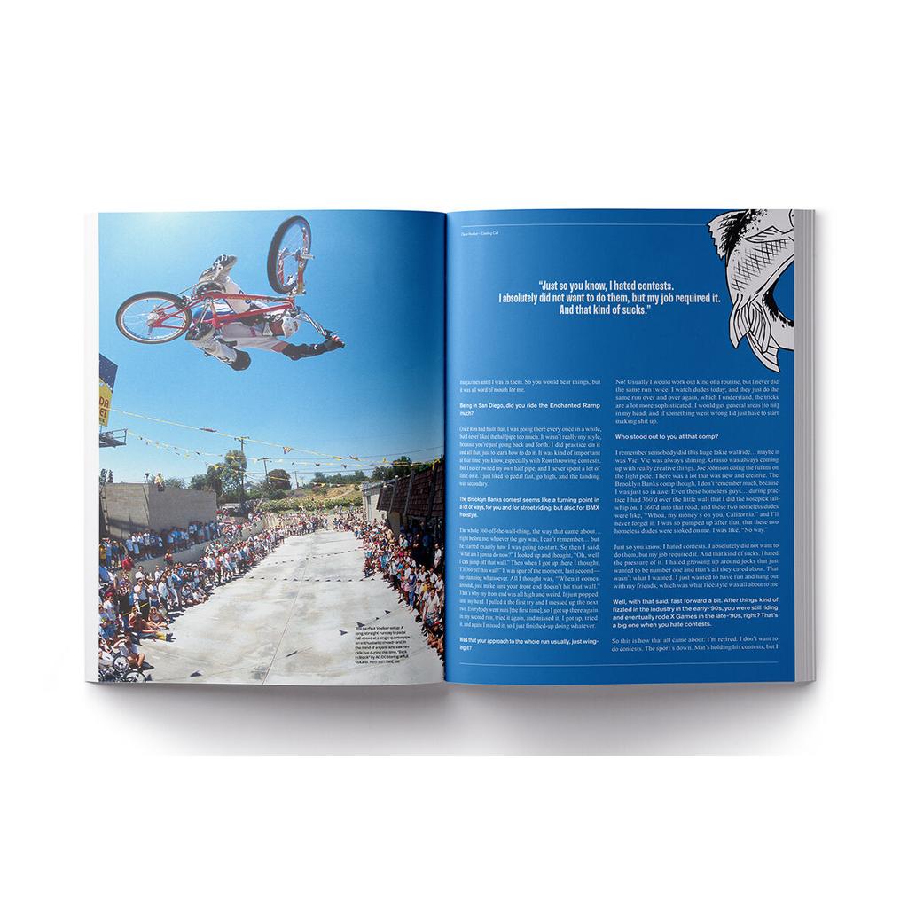 A BMX rider does a mid-air trick above a concrete skatepark as spectators watch; the right page in Grey Stoke BMX Magazine V4 features an interview and a bird’s wing graphic.