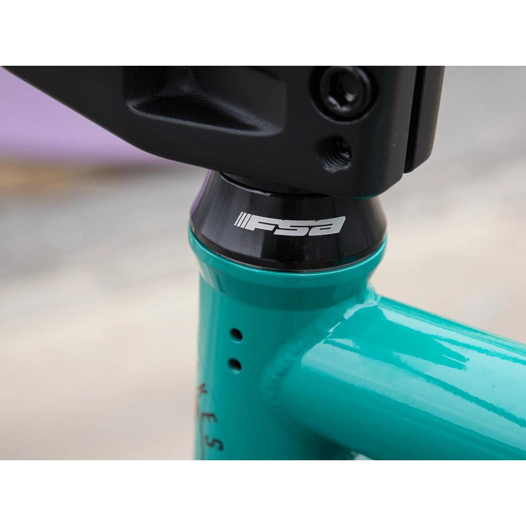 Close-up of the headset with an FSA logo on a teal chromoly Sunday EX Erik Elstran 20 Inch BMX bike frame, highlighting the quality of Odyssey components.