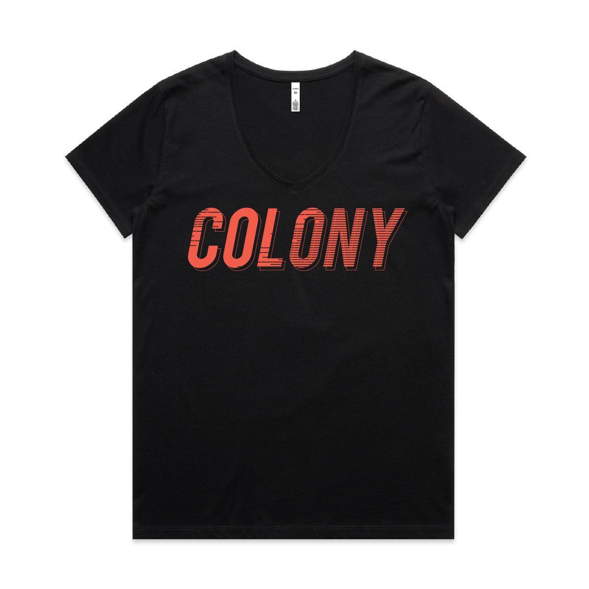 The Colony Momentum Womens V Neck T-Shirt is made from 100% combed cotton and showcases "COLONY" in bold, red, slanted letters across the chest—a stylish tribute to Colony BMX.